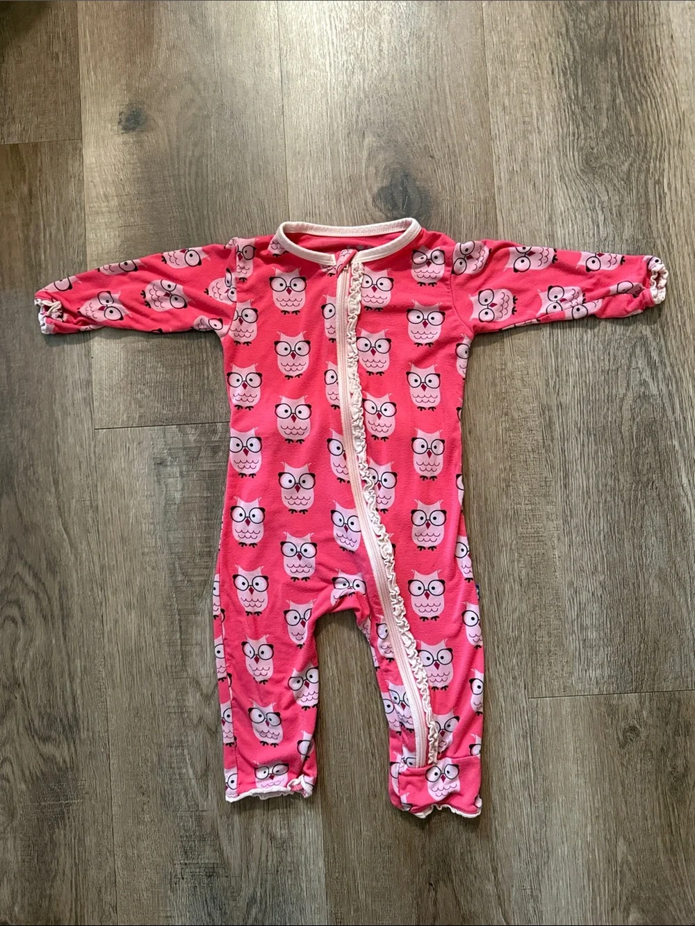 KicKee Pants baby footie features a pink Wise Owl print and a ruffled zipper dow